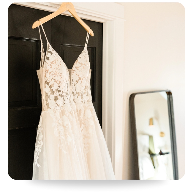 Wedding dress hanging up.